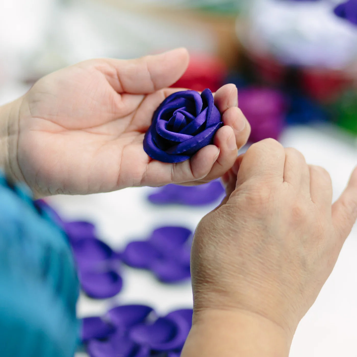 Industry hand-working reference showing an artificial flower in preparation